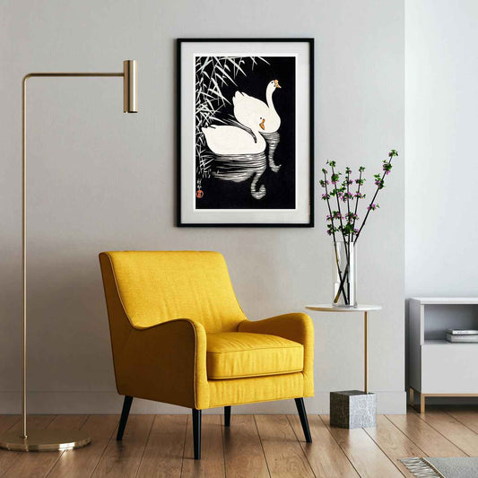 White Chinese Geese Swimming by Reeds