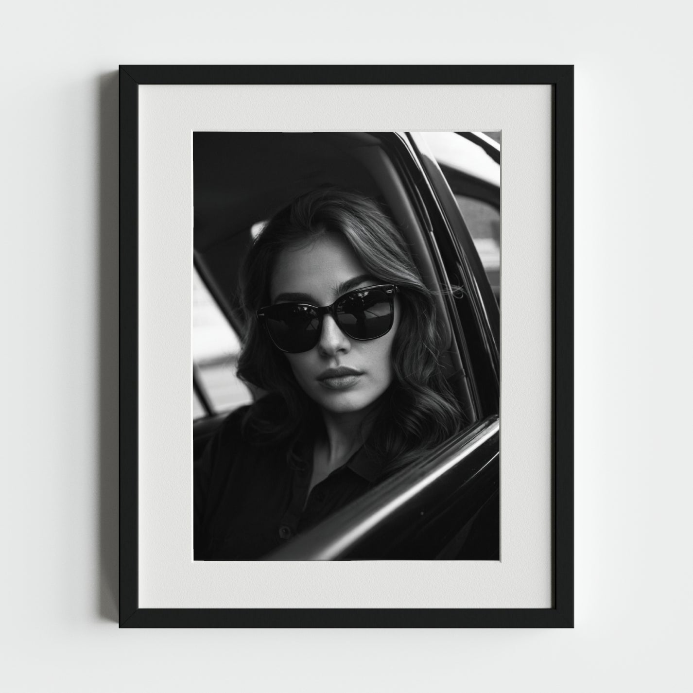 Elegant Black and White Portrait of a Woman in Sunglasses